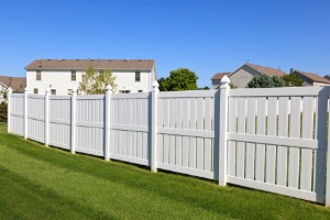 White Vinyl Fencing in Aurora IL protecting a backyard